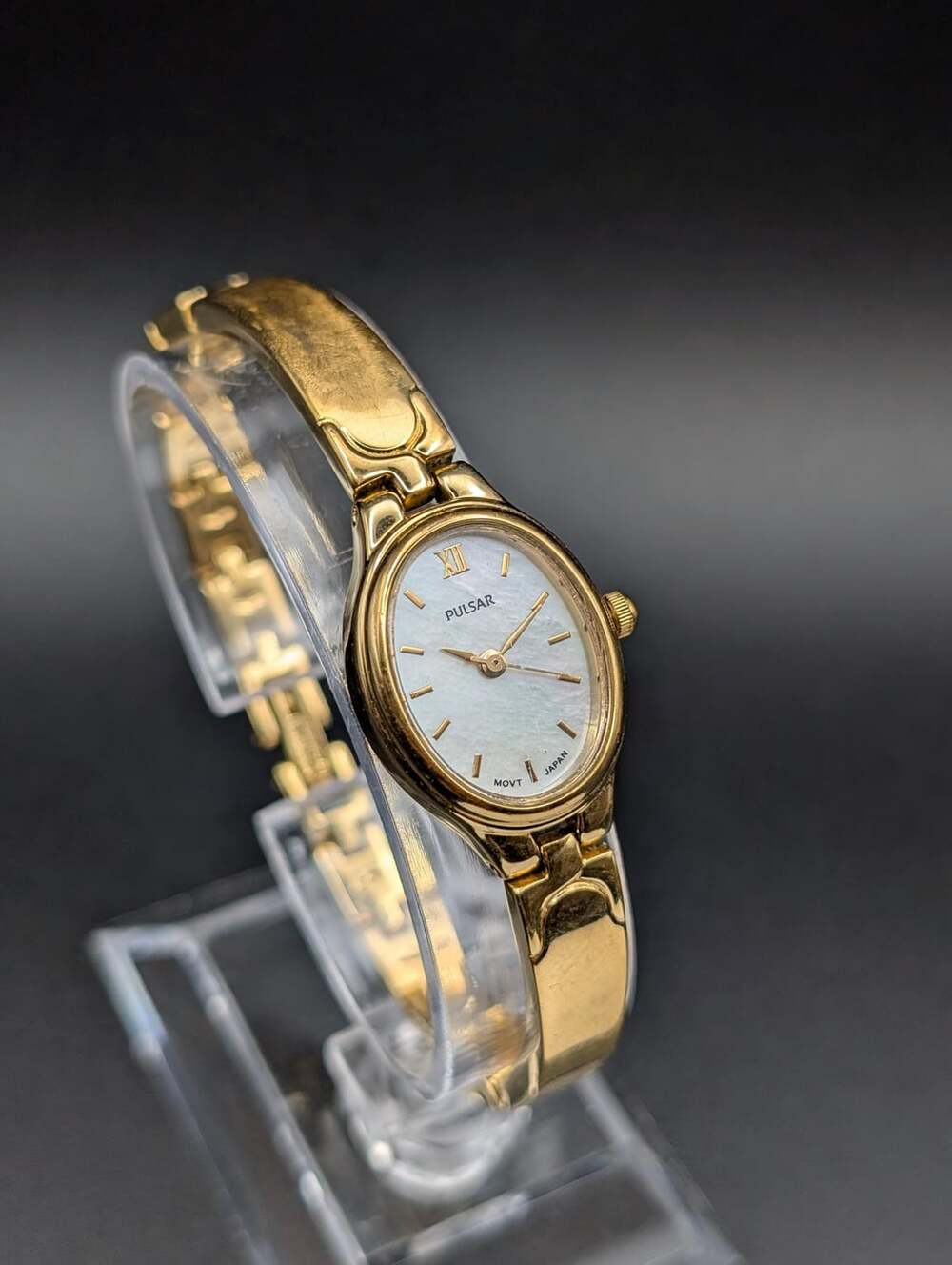 Vintage Pulsar Mother-of-Pearl Gold-Tone Bangle Watch, Elegant Roman Numeral Dia